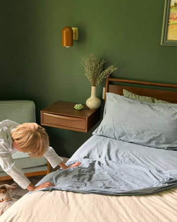 Boy looking under bed. 100% Organic percale cotton.