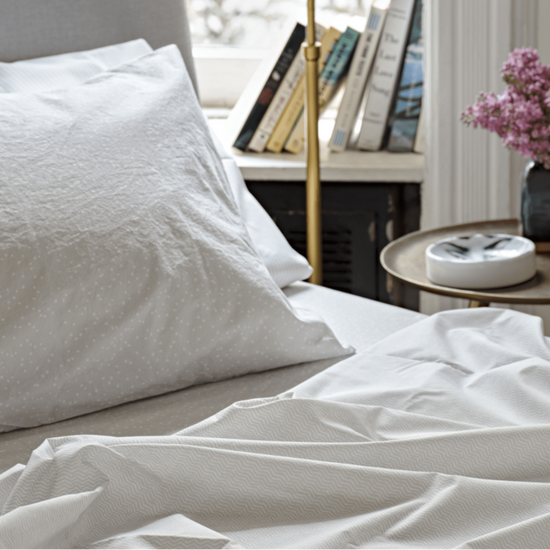 Oyster bedding with books. 100% Organic percale cotton bed sheets. 