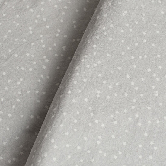 Gray fabric with small white polka stars. 100% Organic percale cotton bed sheets. 
