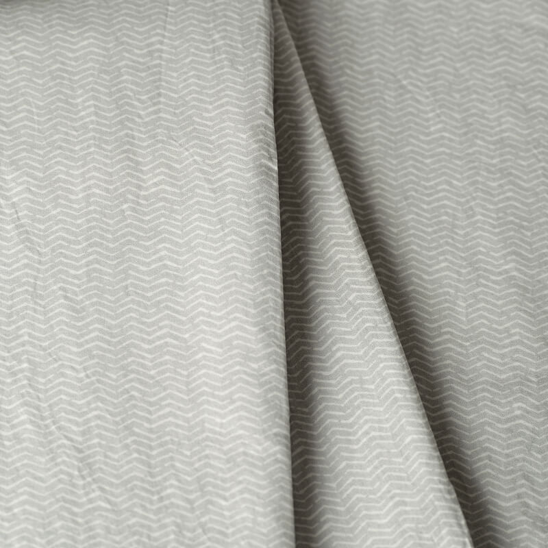 Gray fabric with a subtle pattern. 100% Organic percale cotton bed sheets. 